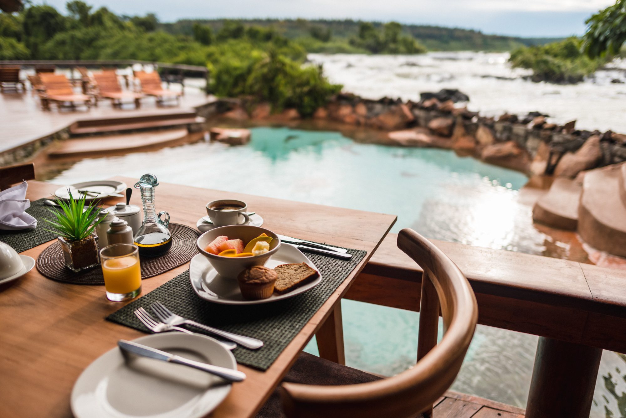 Lemala Wild Waters Lodge sits in a big rainforest on its own island, looking out over the strong Nile River in Jinja in eastern Uganda